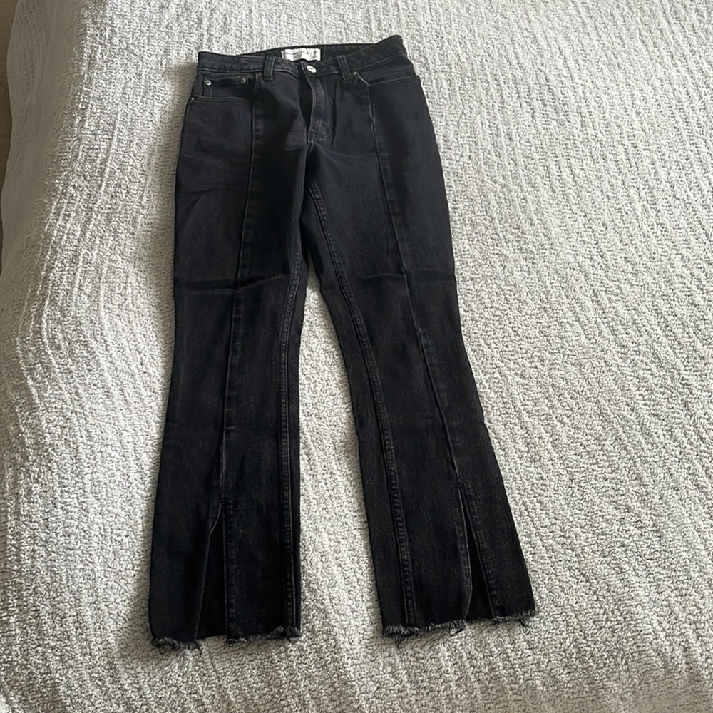 Black jeans with split hem